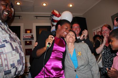 Senator-elect Linda Dorcena Forry: celebrated her election victory on Tuesday night with her mother Annie Dorcena and scores of supporters. Photo by Mike Deehan